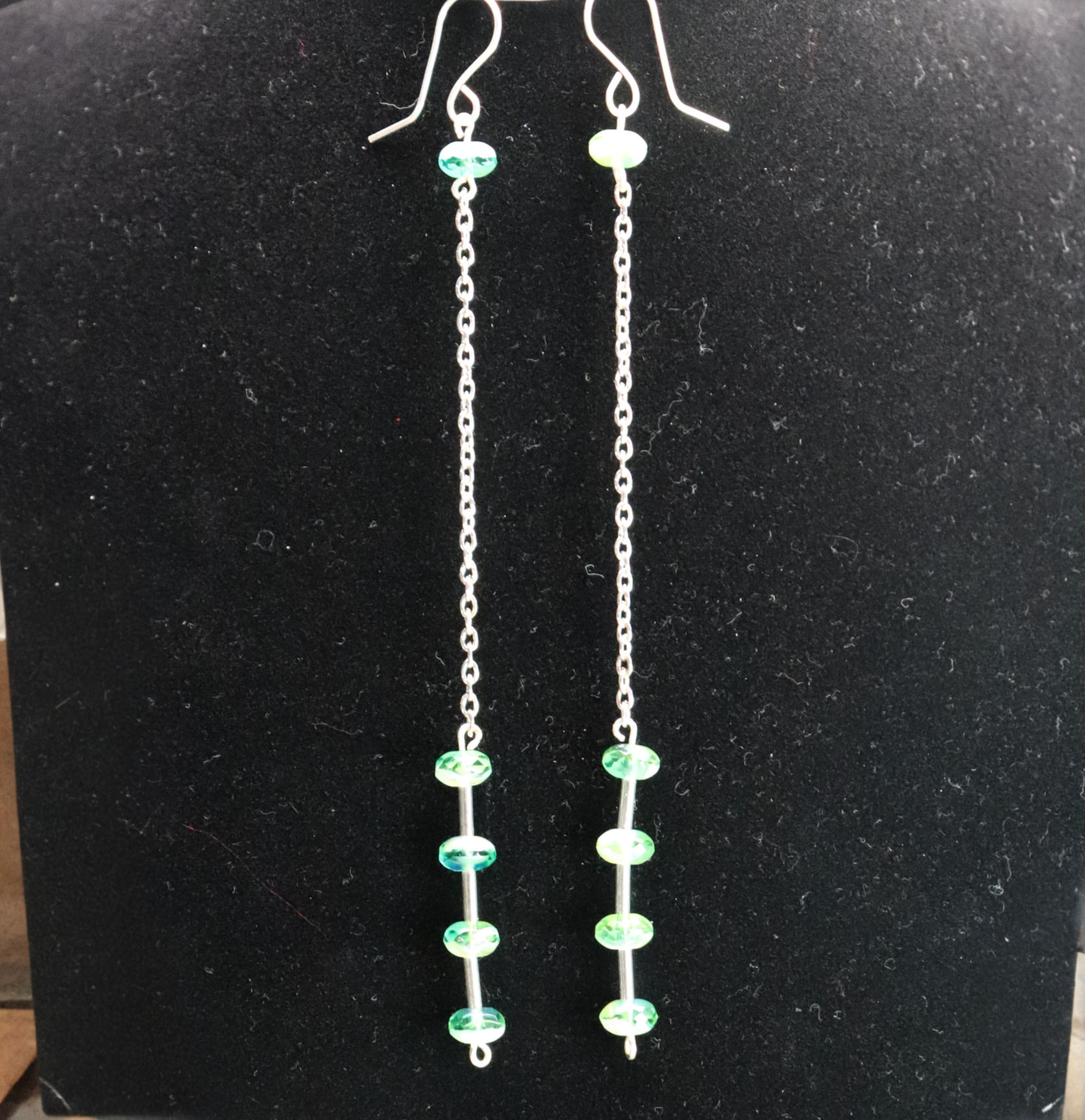 Long drop earrings with green beads on silver chain from Wild GeraniumJewelry.com.