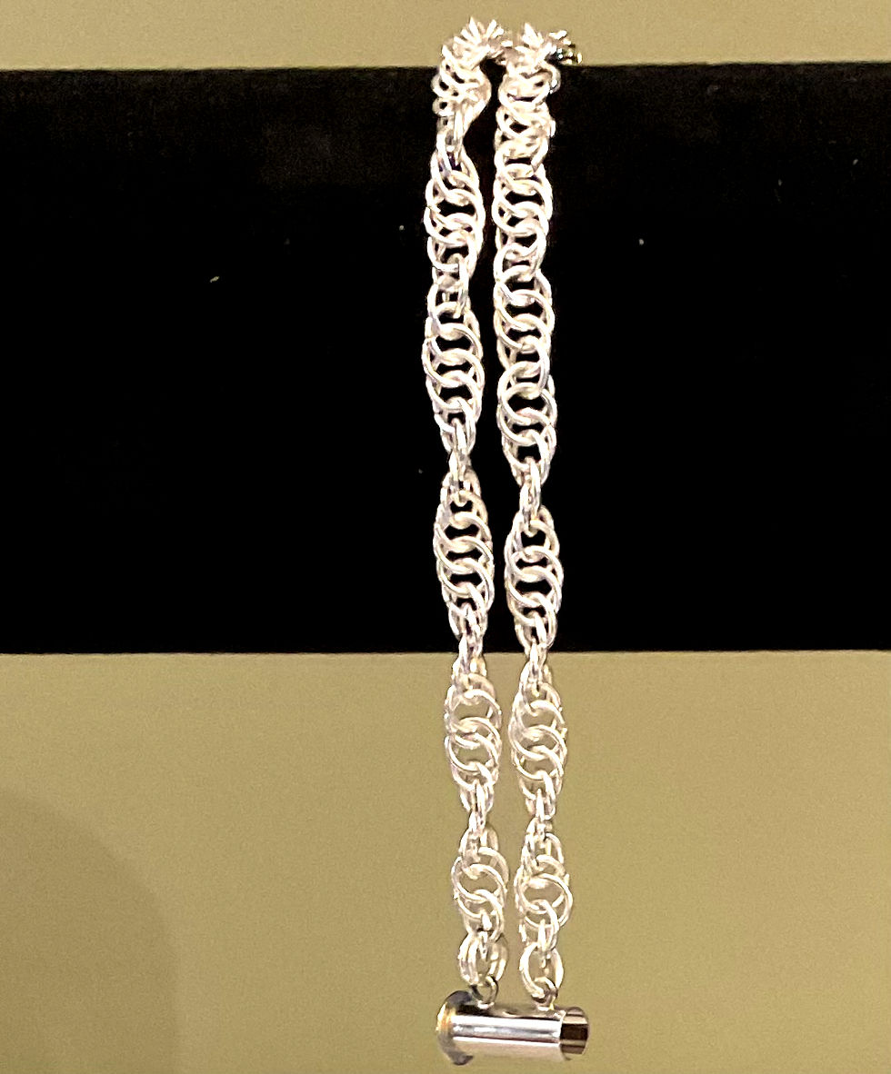 Thumbnail: Double spiral chain bracelet of two rows of silver rings handcrafted in a spiral pattern