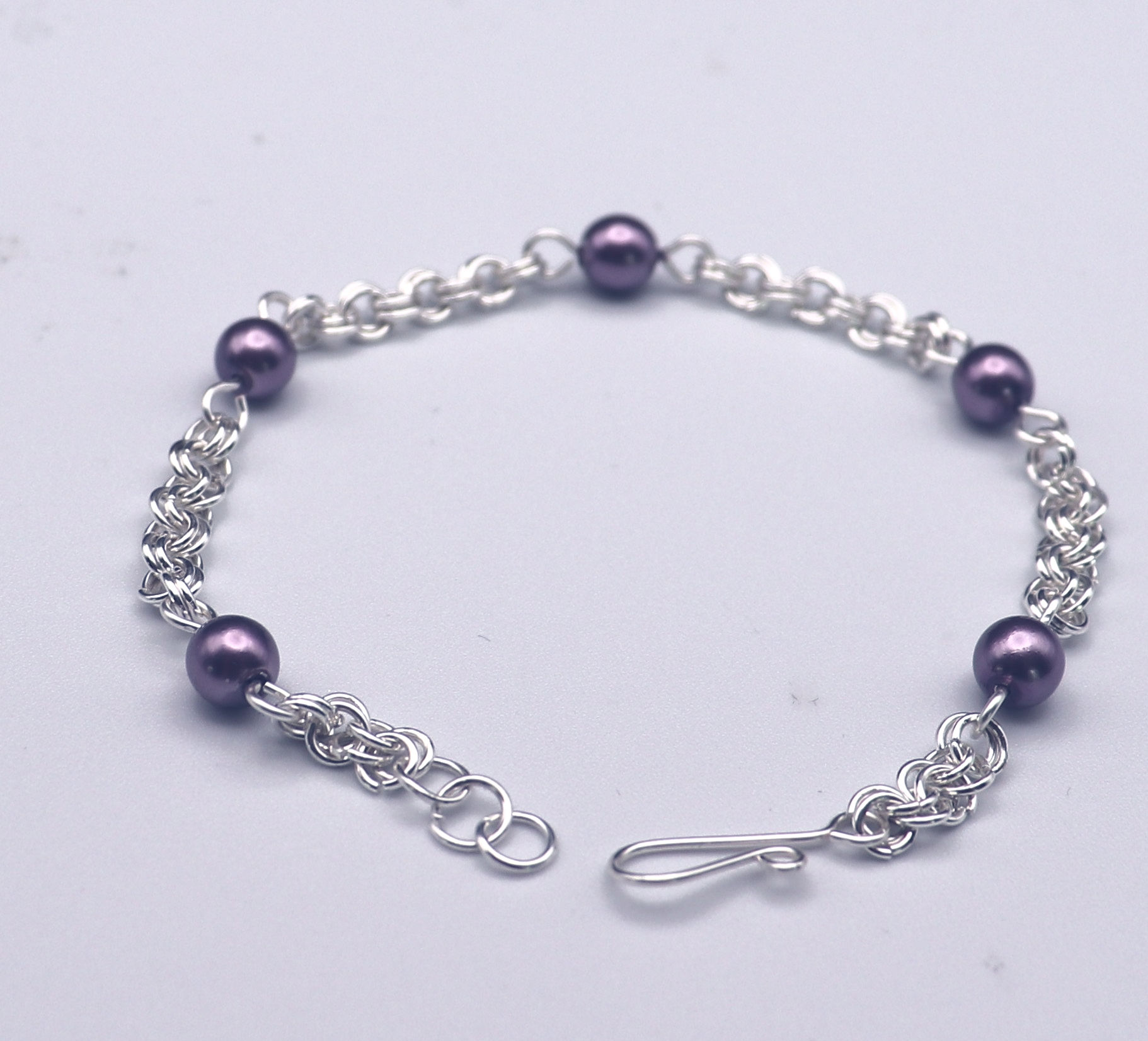 Lavendar glass pearls in a double ring silver chain bracelet from WildGeraniumJewelry.com