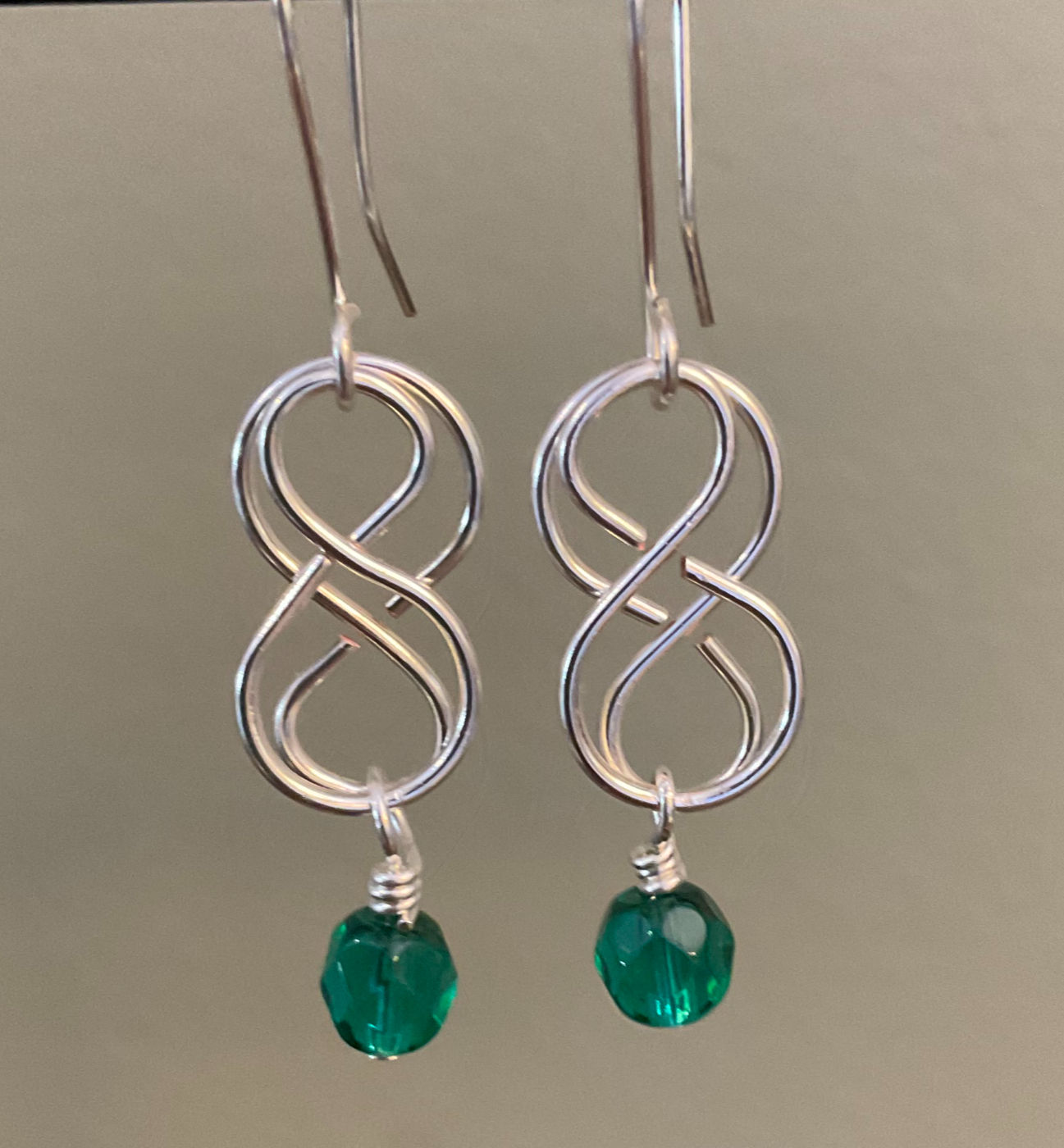 Handcrafted Silver Celtic Weave earrings with emerald green crystal bead from Wild Geranium Jewelry
