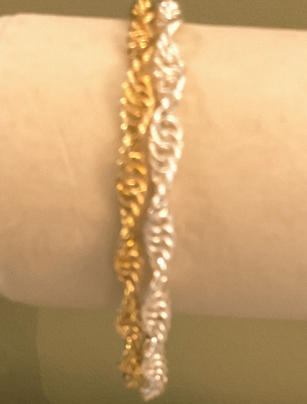 Double spiral chain bracelet of two rows of silver and gold rings handcrafted in a spiral pattern