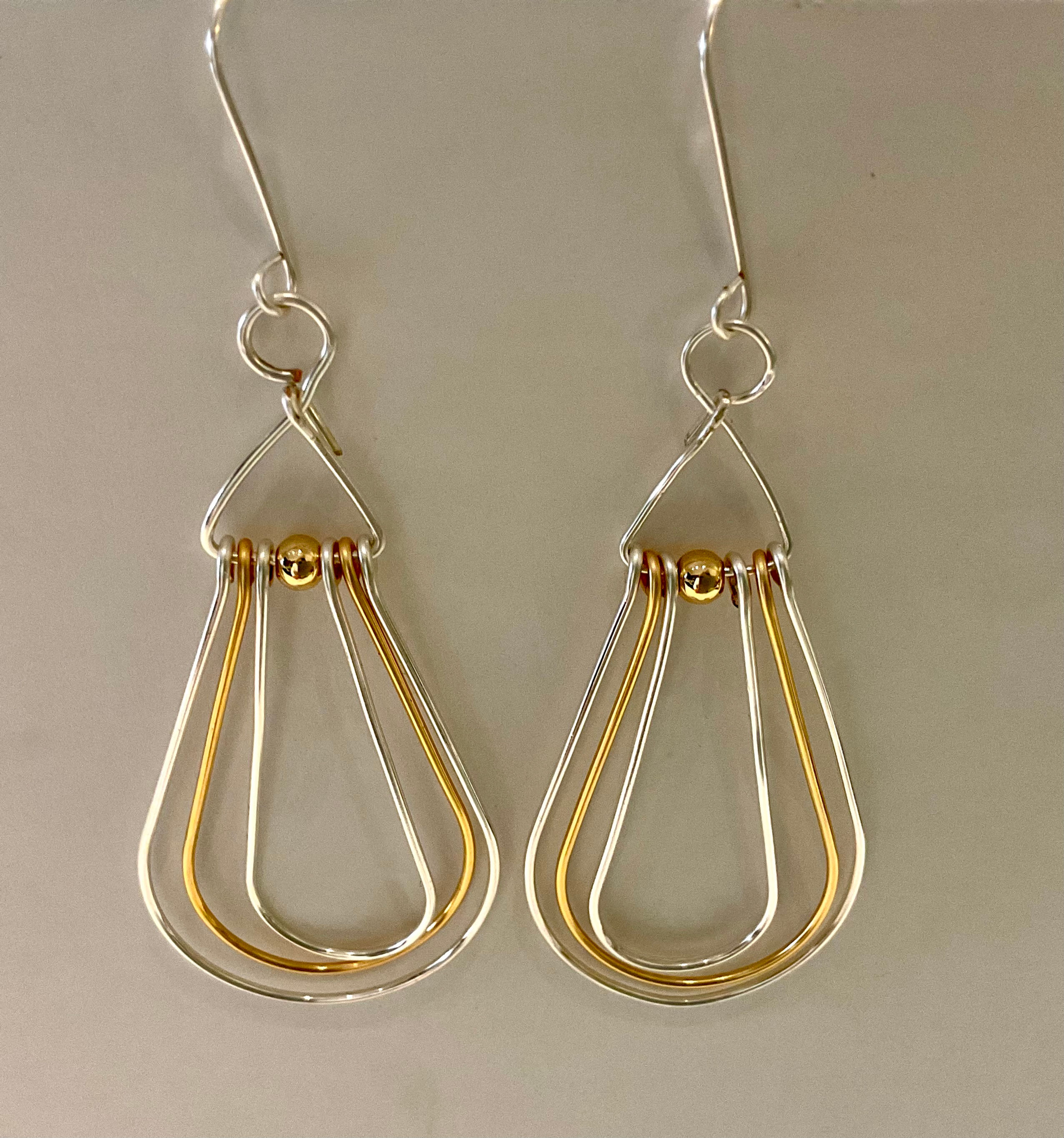 Dangling Hoop earrings made of gold and silver wire, from WildGeraniumJewerly.com