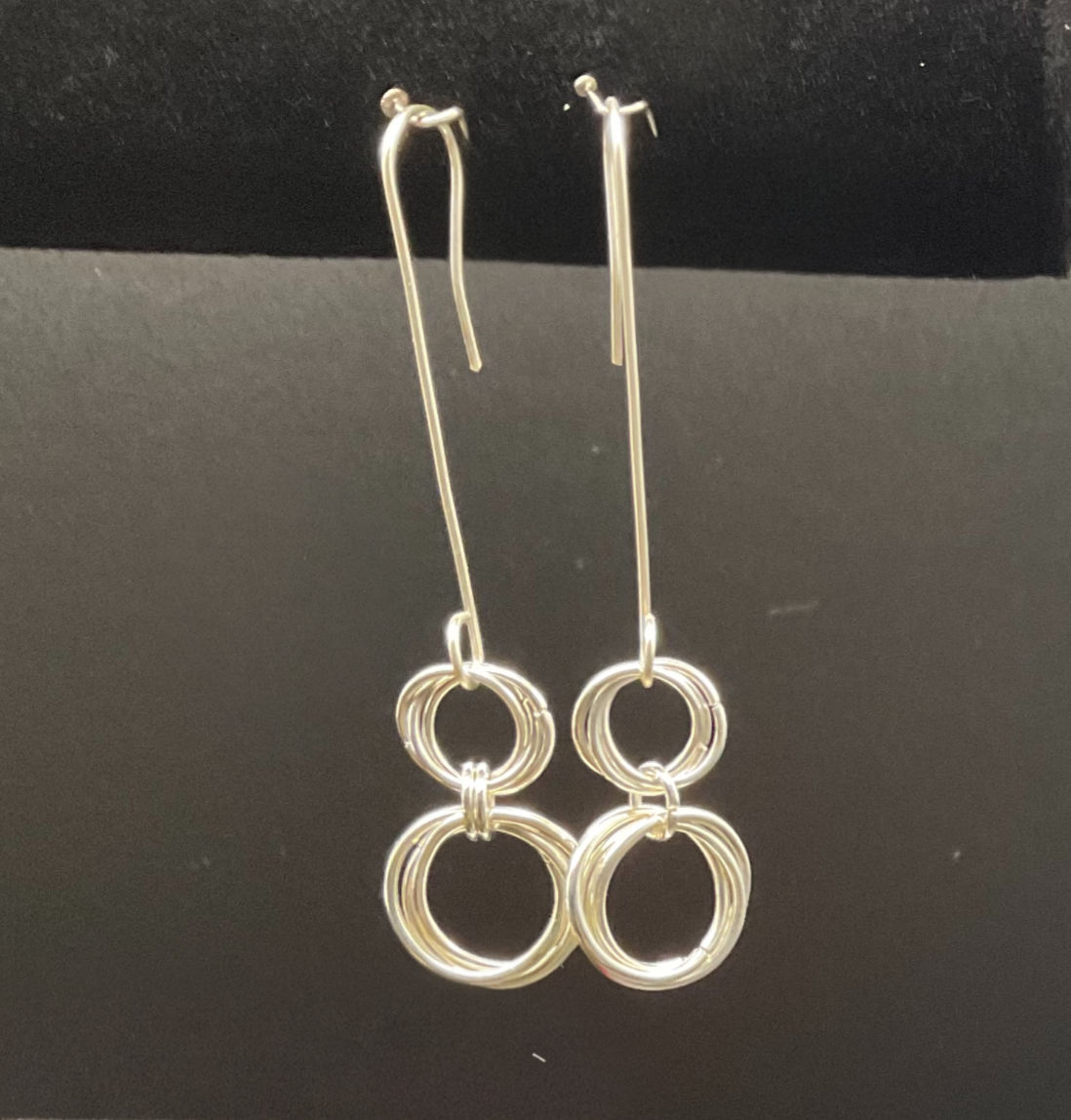 Long earrings handmade of silver spiral rings on silver wire from WildGeraniumJewelry