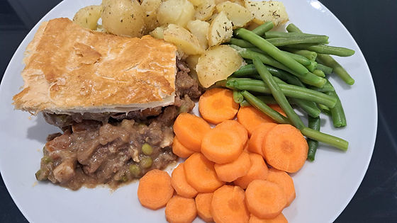 Steak Pie Served With Herbie New Potatoes Carrots & Peas