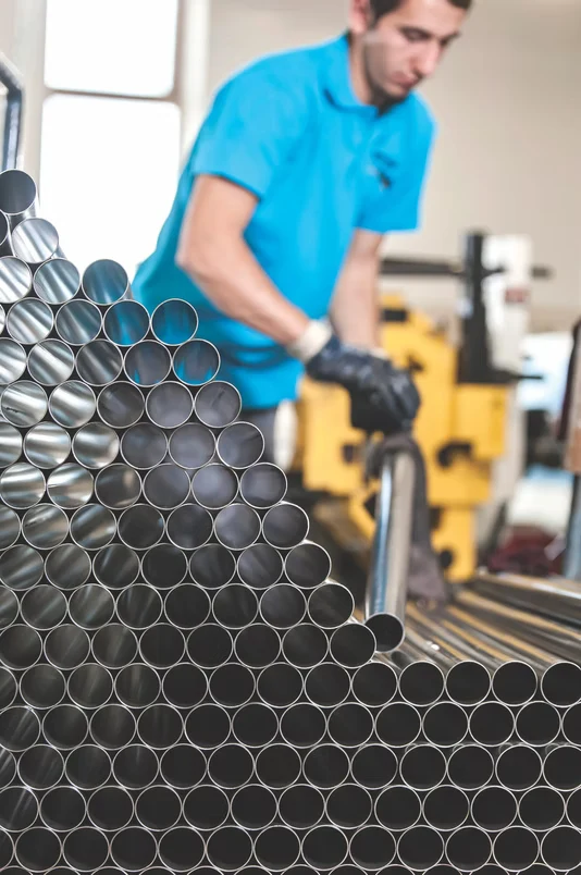 Metal tubes ready for processing in Beformet’s production area
