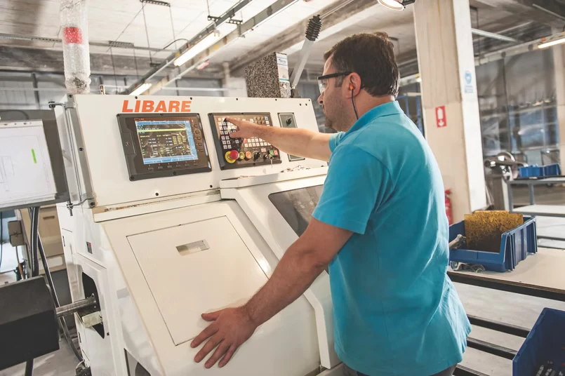 Operator working at a CNC lathe