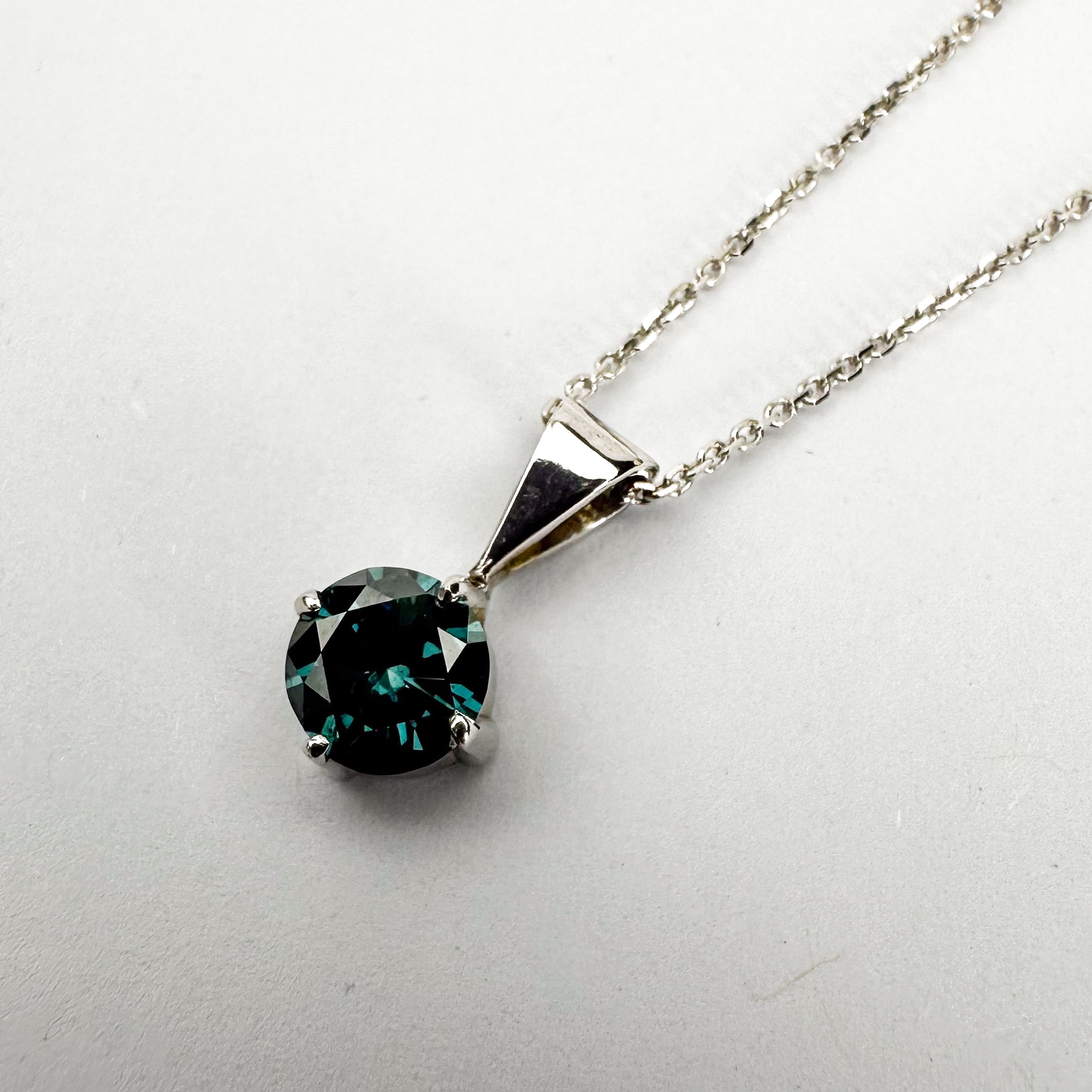 Treated blue diamond solitaire pendant