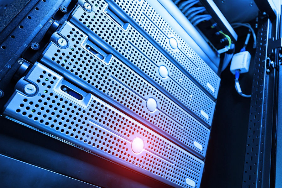 Server room with blinking lights, representing digital infrastructure.