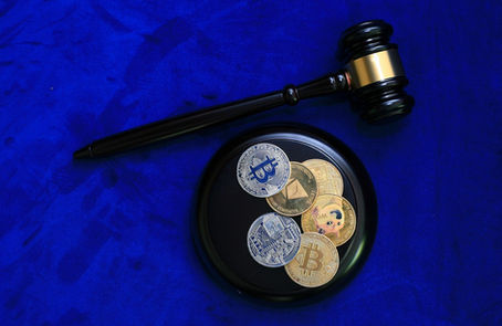 Bitcoin and regulatory gavel symbolize market challenges.