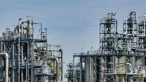 Oil refinery silhouette, symbolizing Middle East geopolitical tensions.
