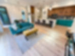 This mid century green couch highlighted the custom cabinetry