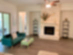 The green sofa & coffee table pull the outside in
