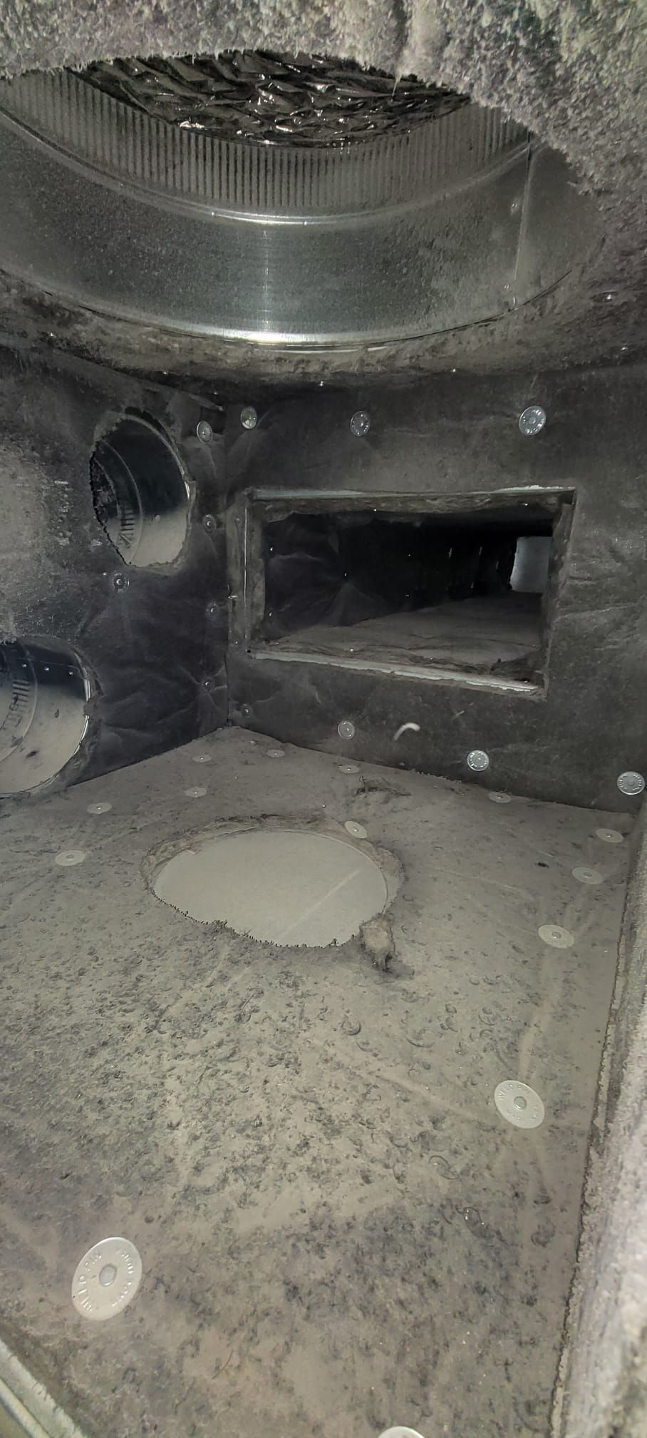 Dirty and obstructed air duct in Westchester before cleaning.