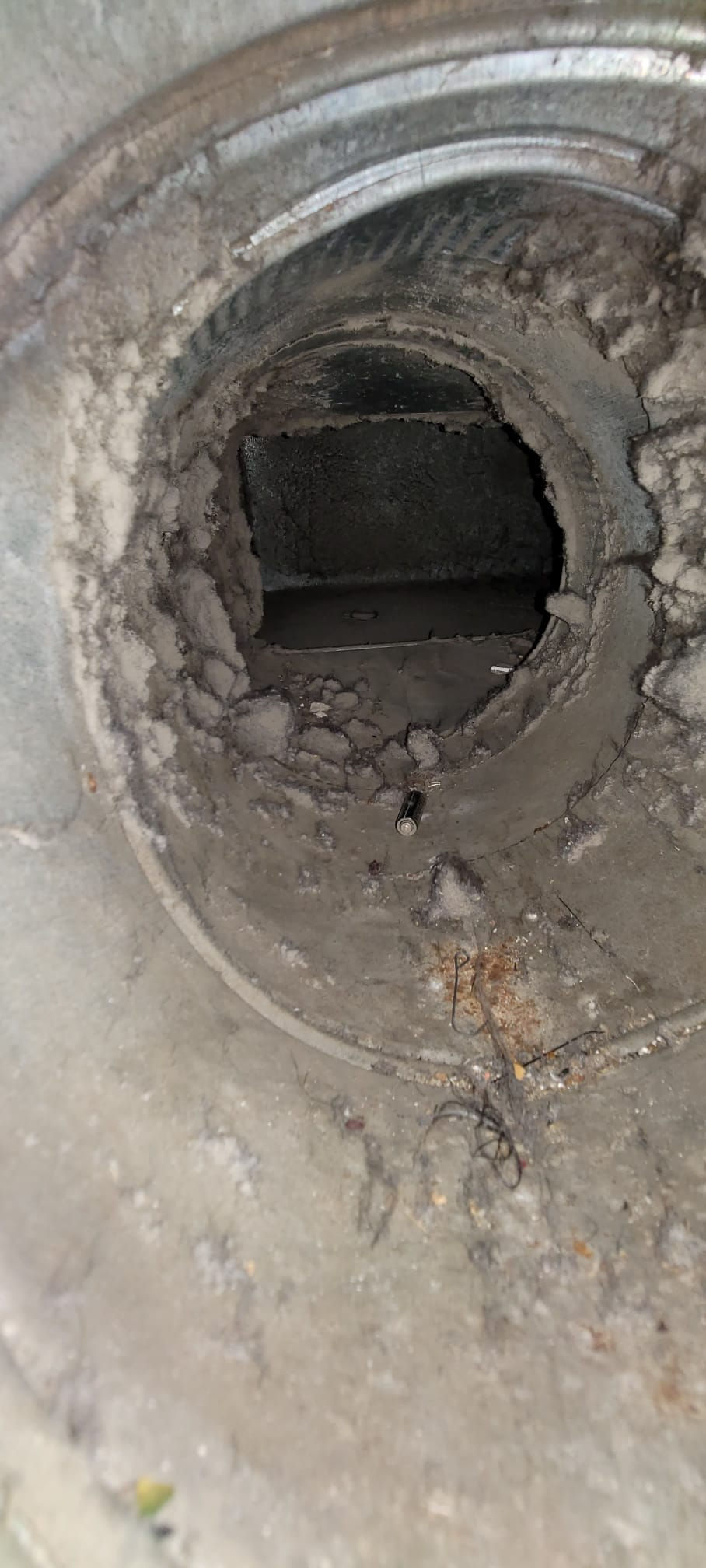 Dirt accumulation in air duct in Yonkers before service. HVAC