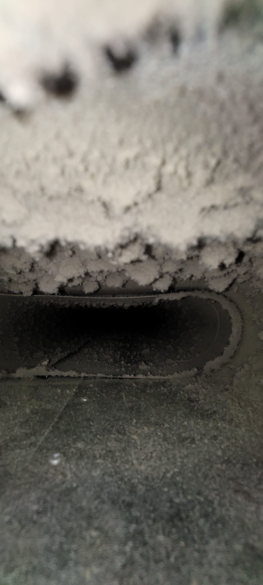 Before air duct cleaning in Irvington, NY, showing significant dust accumulation. vac