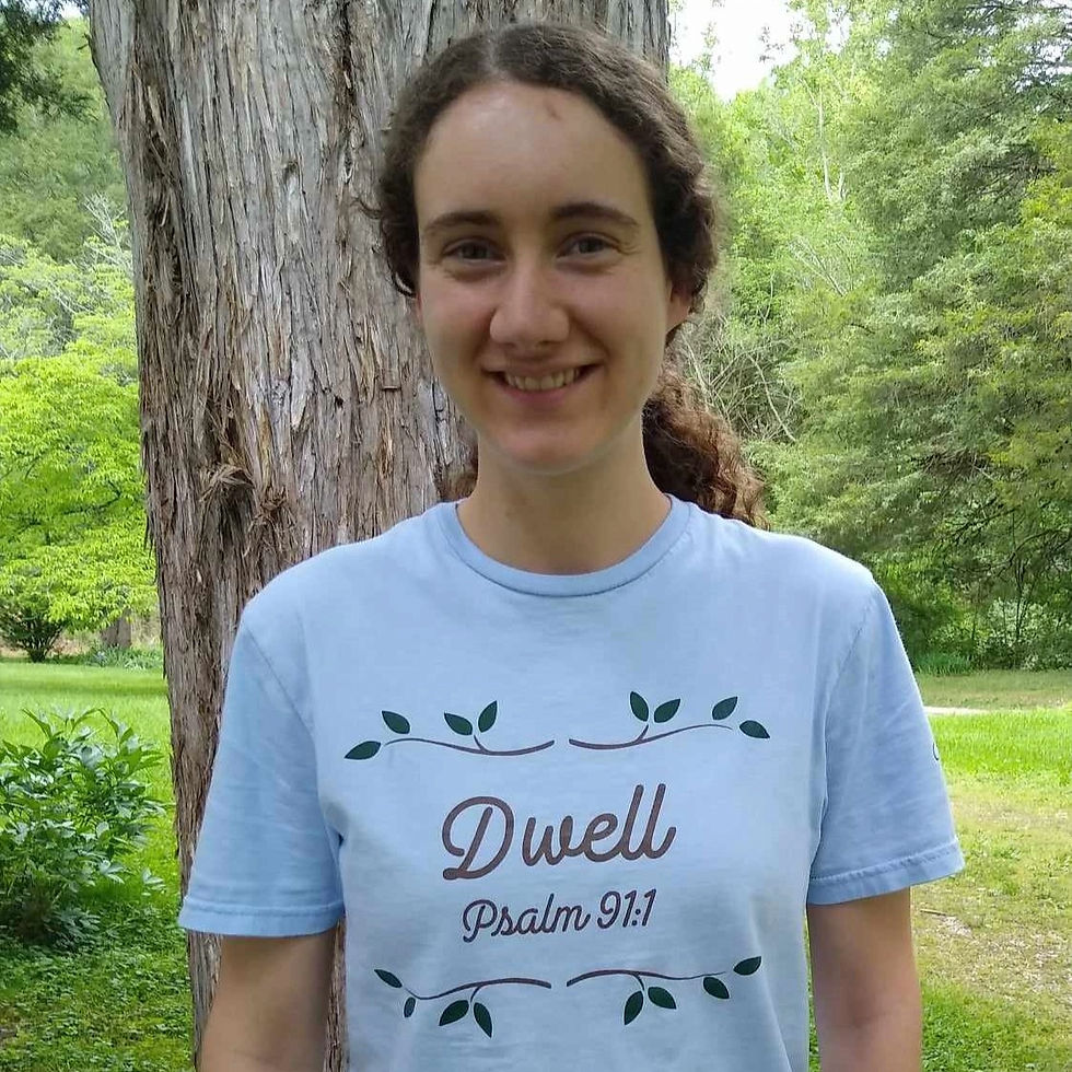Woman wearing light-blue "Dwell Psalm 91" shirt