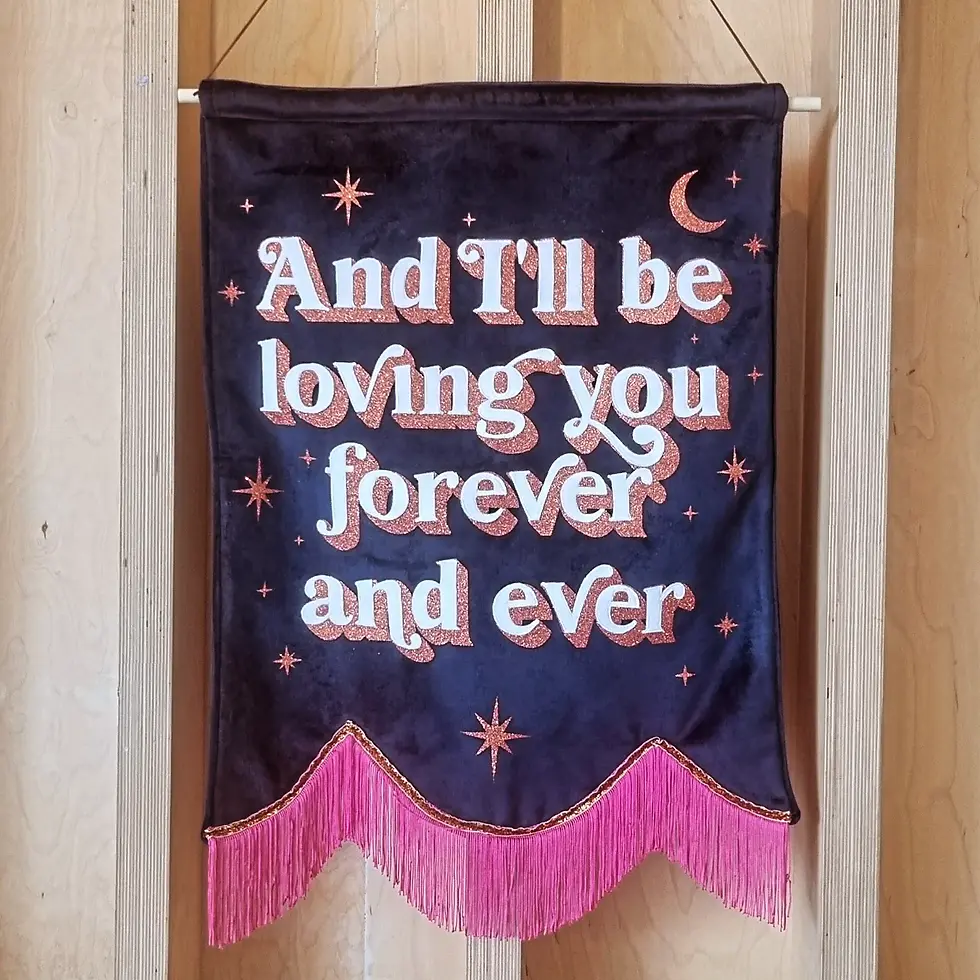 A velvet banner with the words: "And I'll be loving you forever and ever" with stars all over the banner