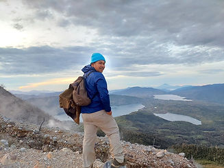 Hiker overlooking lakes and mountains