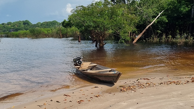 A small boat on the beach in the Rio Negro, near Novo Airao