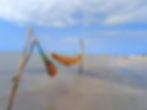 Hammocks in the ocean at Antunes Beach Maragogi