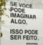 Graffiti on a white wall that says "se voce pode imaginar algo, isso pode ser feito" (if you can imagine something, it can be done)