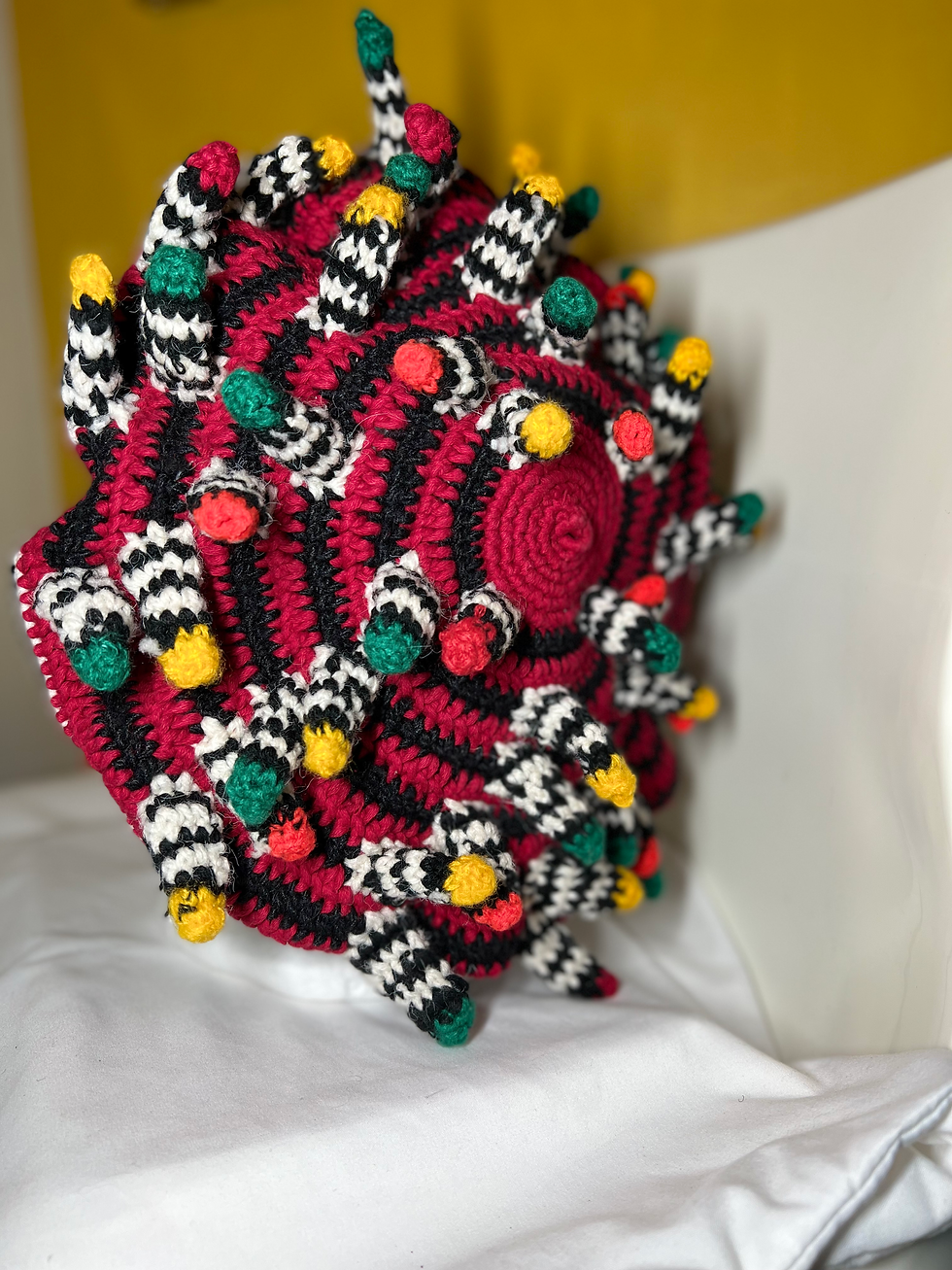Thumbnail: Red, Green, Pink, White, Yellow, Red, and Black Bamileke Hat with Peanuts