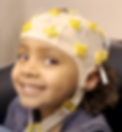 Child wearing an EEG cap
