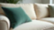Dark green velvet cushion on cream sofa