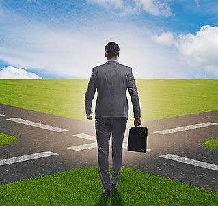 pngtree-the-young-businessman-at-crossroads-in-uncertainty-concept-young-businessman-at-ph