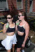 woman wearing The Nourished Club contrast sports bra and leggings, front view