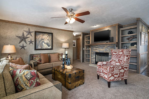 Example of a manufactured home living room with neutral finishes, open layout, and large windows – similar to models at Oxford Housing Inc