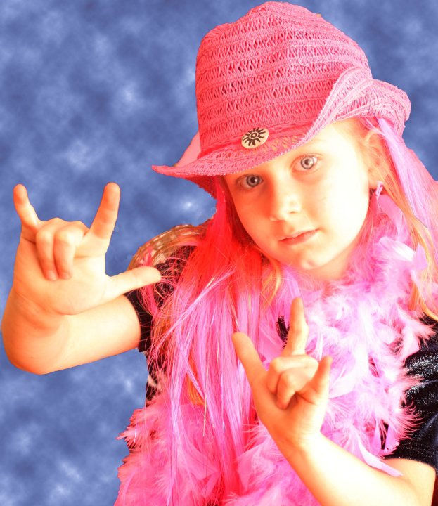 My little Rockstar (she chose to do the I love you sign language instead of the horns up lol)