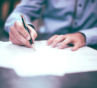 Man Writing Document