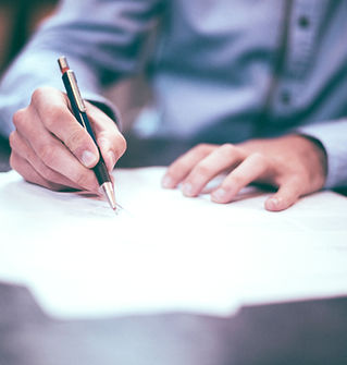 Man Writing Document