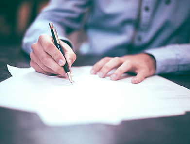 Man Writing Document