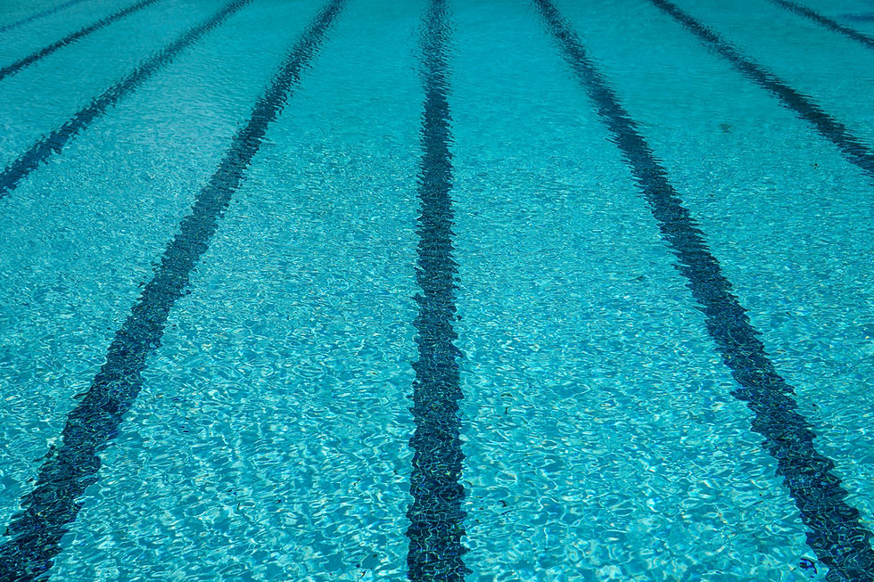 A surreal image of a face with overlapping hands and layers, in red and orange hues.