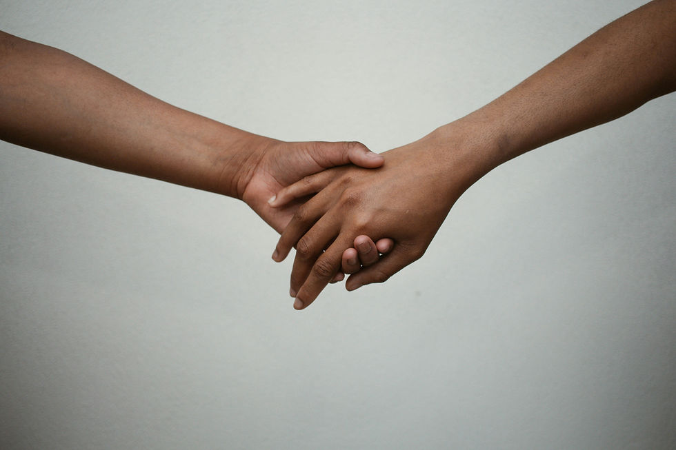 Two hands holding each other.