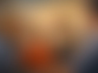 Parents and a young child sit together during a supportive therapy session with a psychologist, showing warm interaction and connection that reflects compassion-focused parent training and family-based care