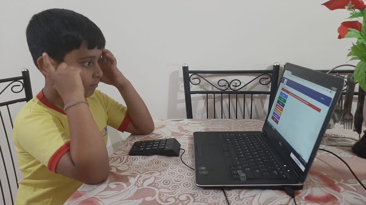 A SPARK learner practising with her abacus