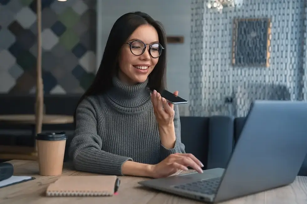 business woman voice mailing while facing her laptop