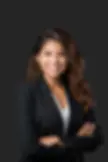 woman smiling in black blazer