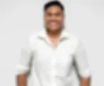 man wearing white long sleeve polo smiling