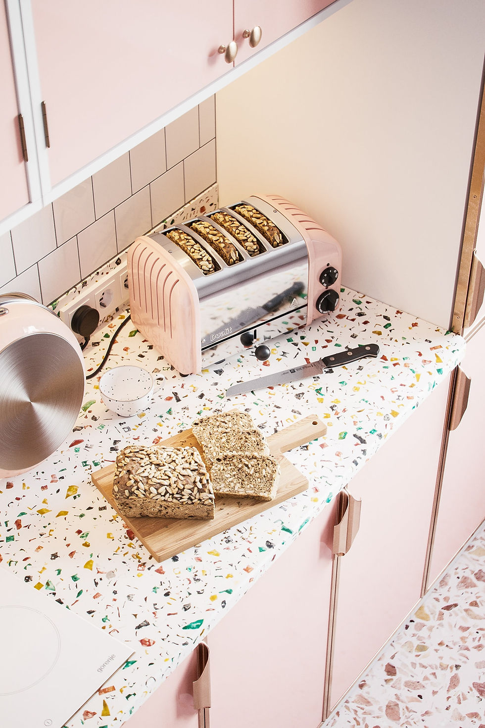 candy pink kitchen cabinets and tutti frutti terrazzo worktop