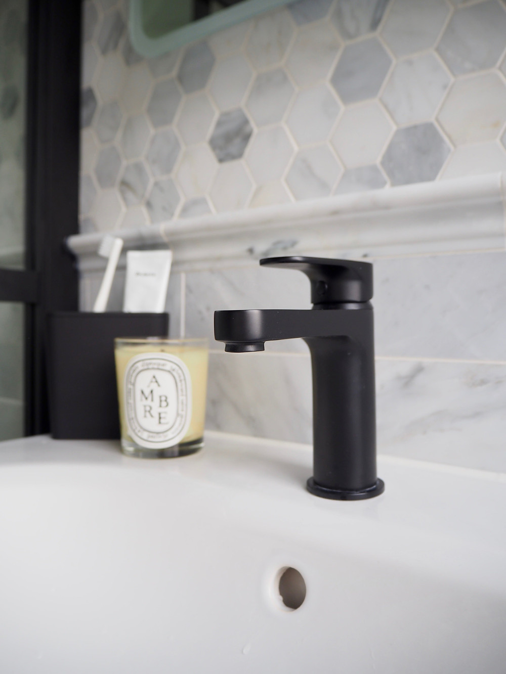 Methven Breeze Matt Black washbasin mixer tap and marble hexagon tiles from Mandarin Stone, VitrA Frame sink vanity