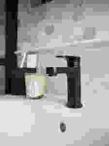 Methven Breeze Matt Black washbasin mixer tap and marble hexagon tiles from Mandarin Stone, VitrA Frame sink vanity