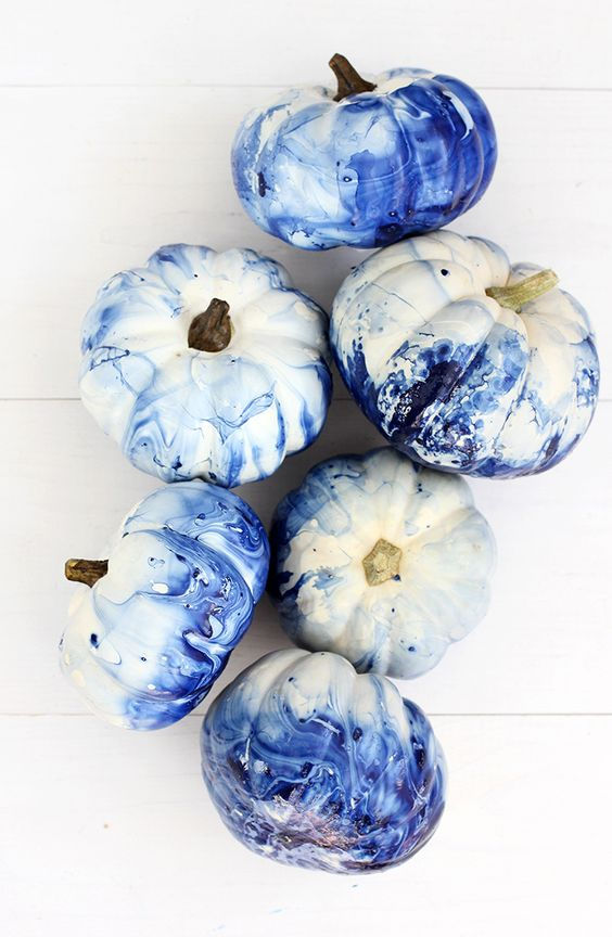marbled indigo pumpkins that have been dip dyed in nail polish