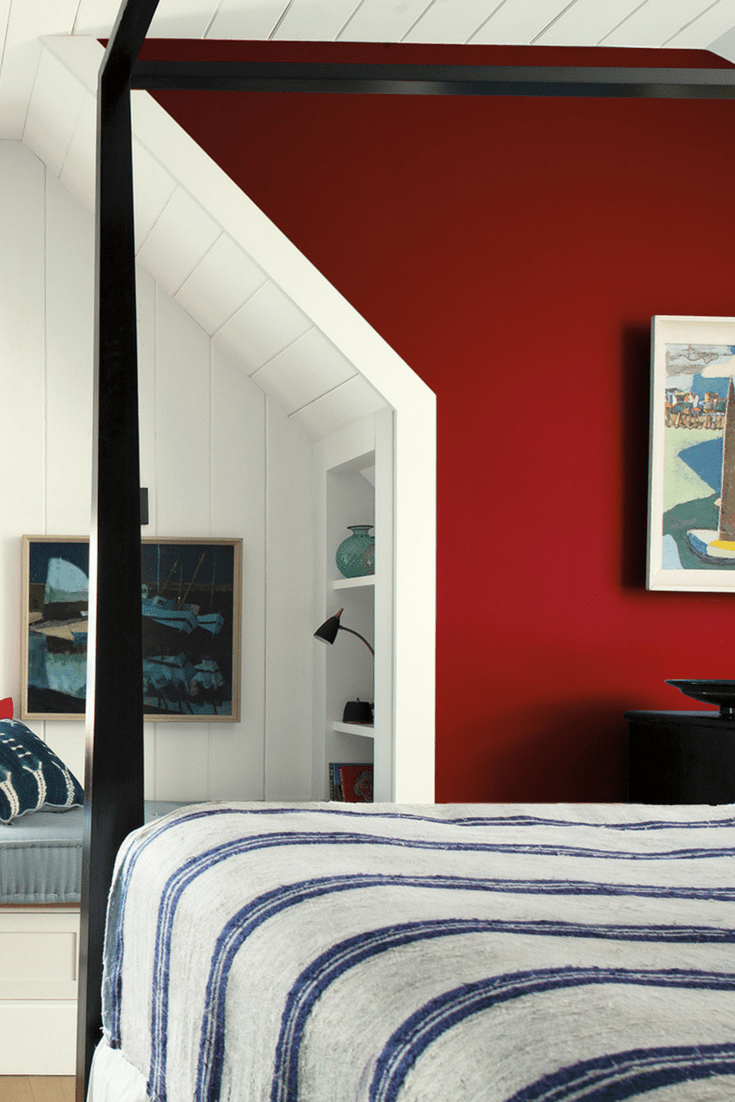 How to decorate your bedroom with red and crisp white for a modern look even nautical - this could be in the Hamptons! 4 poster bed and artwork. Benjamin Moore has revealed Caliente AF-290 as its highly anticipated Colour of the Year 2018. Unveiled alongside a corresponding palette consisting of 22 enlivening hues, this vibrant and charismatic shade of red is a bold yet soothing contemporary colour that oozes confidence. Wall colour - Caliente AF-290, Trim & Door colour - White Opulence OC-69