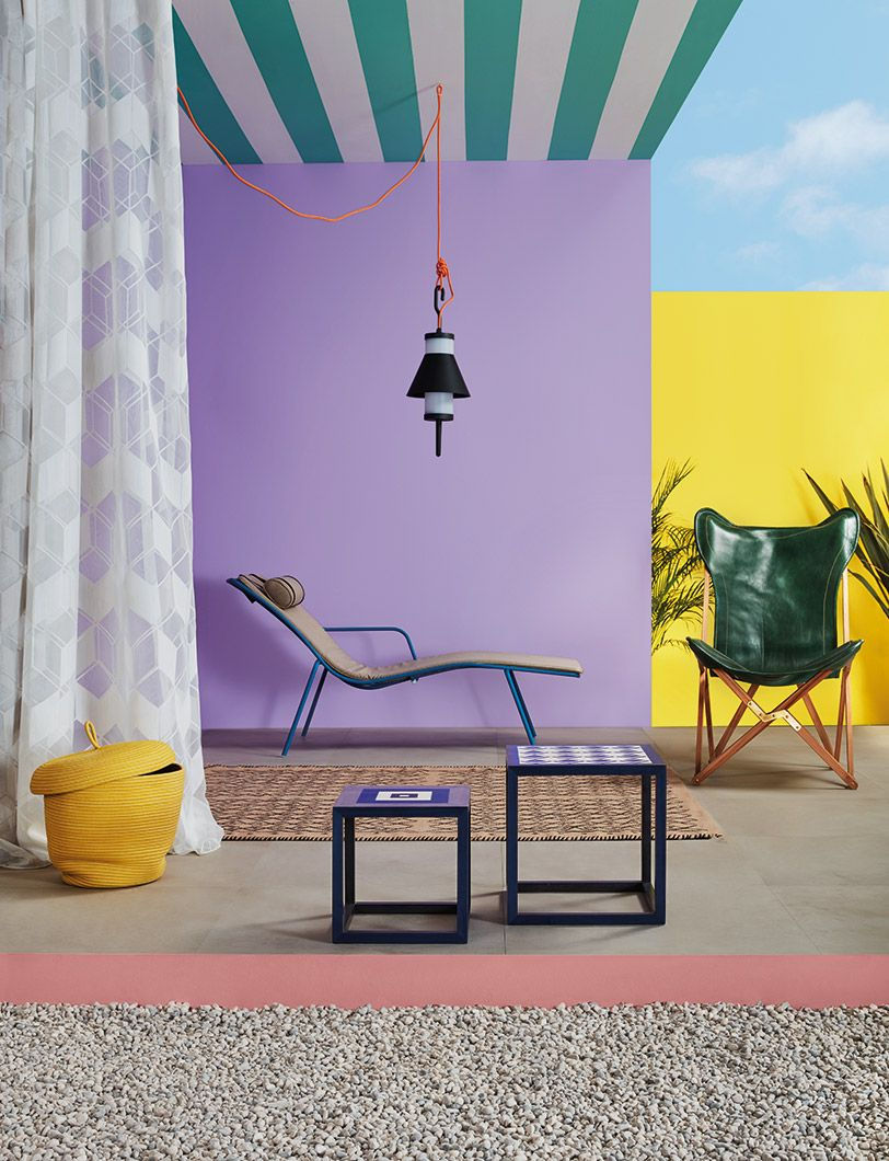 Creative ways to use paint around your home | Green stripes painted on a ceiling in an outdoors space with lilac wall | Seasons in Colour Interiors Blog