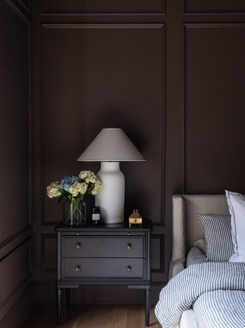 bedroom painted in dark brown color