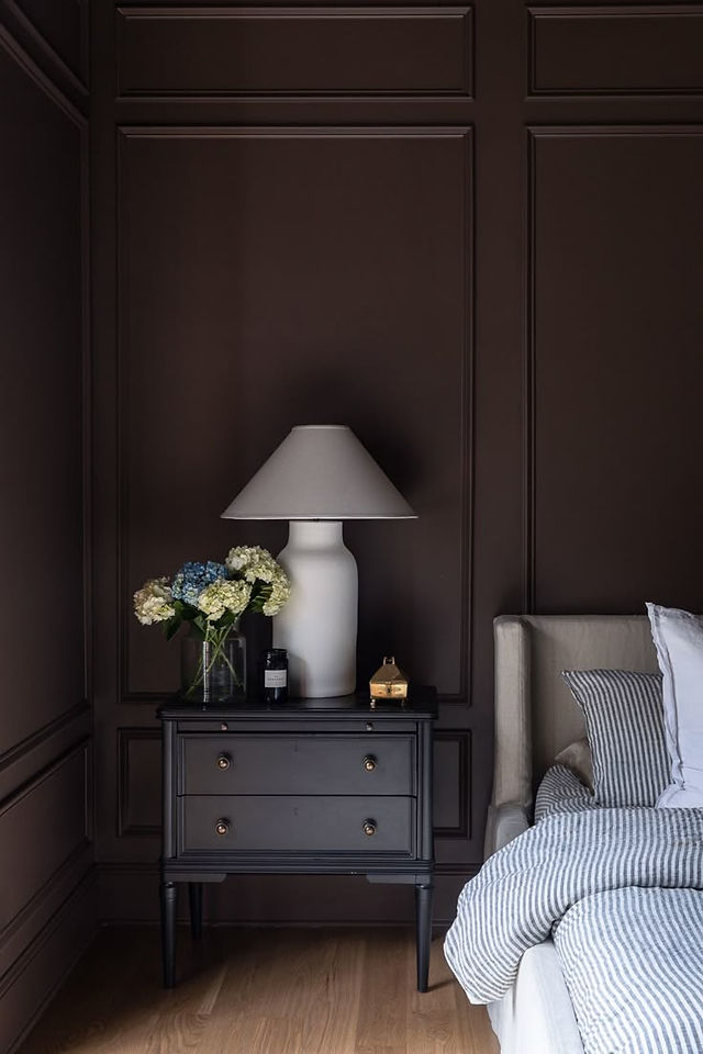 bedroom painted in dark brown color